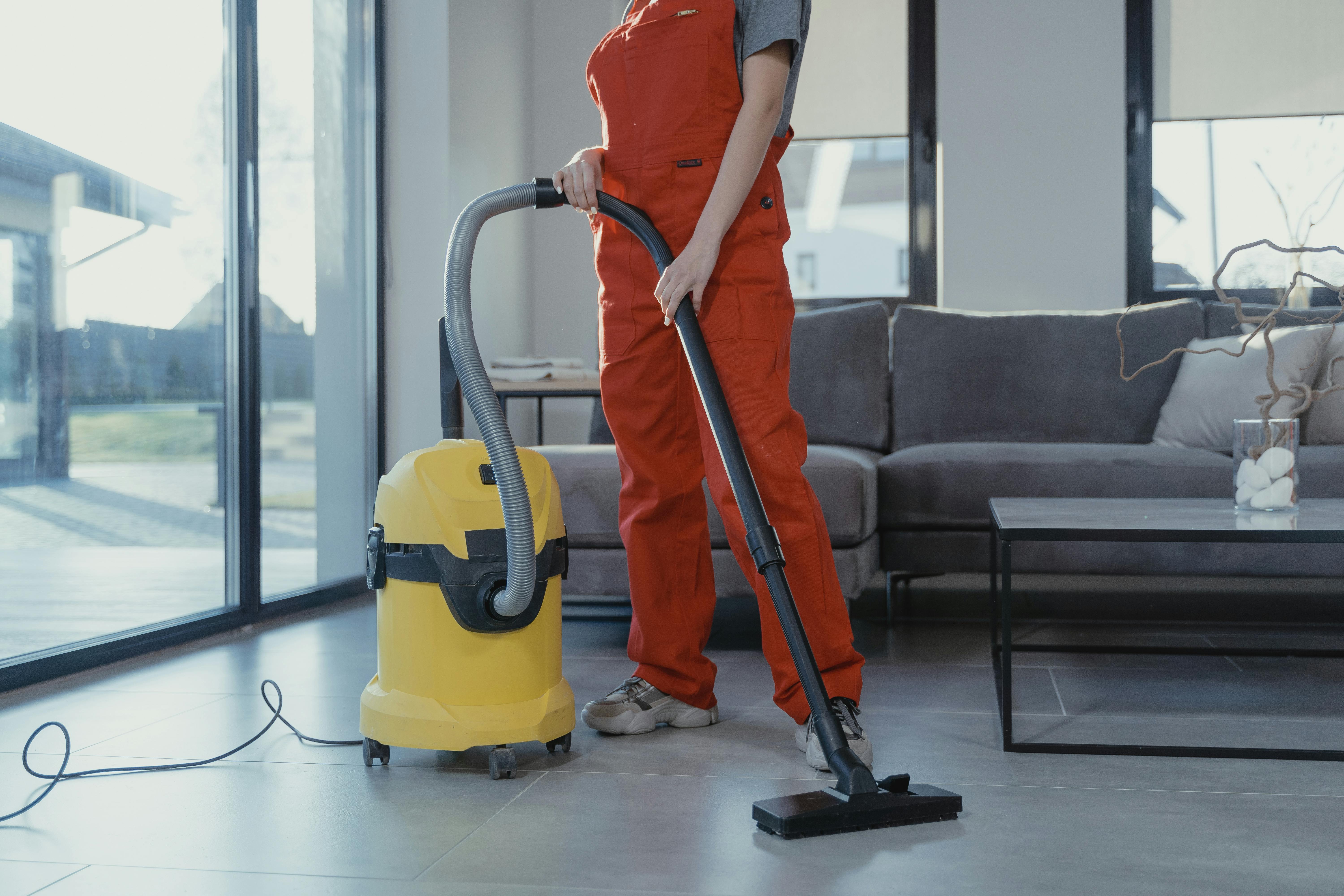 Cleaning a living room with vacuum